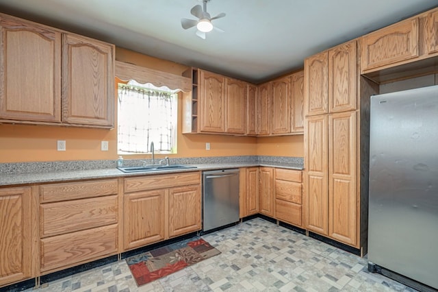 kitchen featuring ceiling fan, sink, and stainless steel appliances