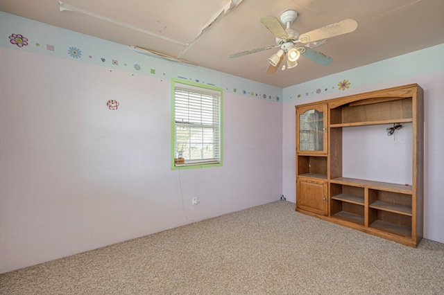 unfurnished bedroom featuring ceiling fan and light colored carpet