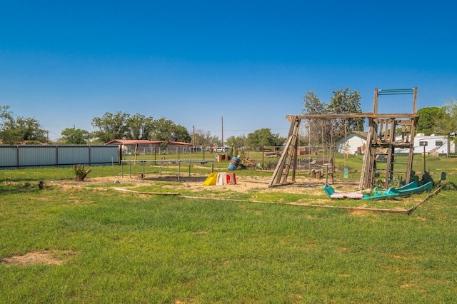 view of playground with a lawn