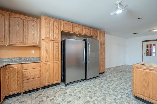 kitchen featuring stainless steel fridge and ceiling fan