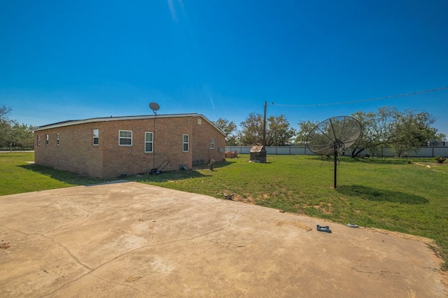 rear view of house featuring a yard