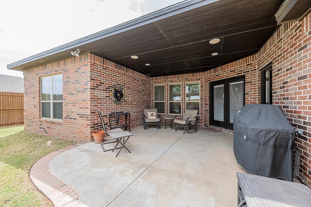 view of patio featuring fence