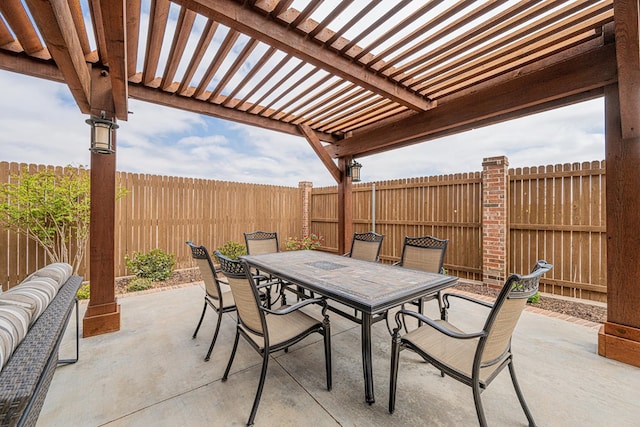 view of patio with a pergola, outdoor dining space, and a fenced backyard