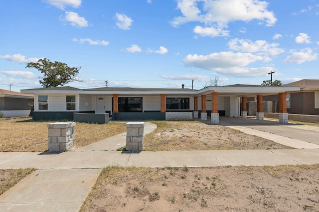 ranch-style house with a carport