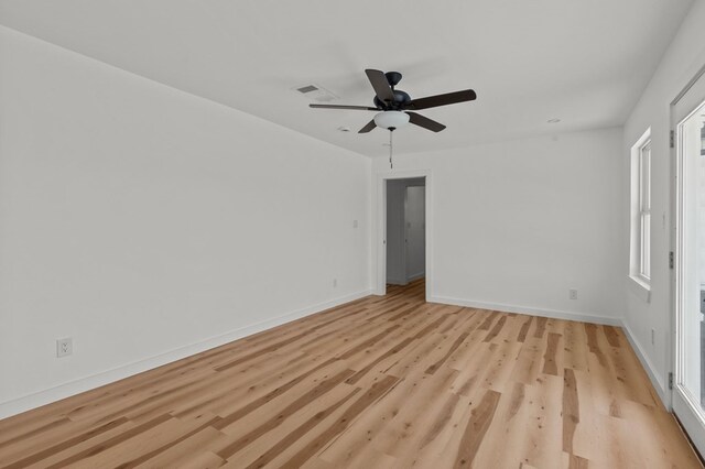 empty room featuring ceiling fan and light hardwood / wood-style floors