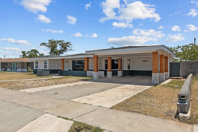 view of front of home with a carport