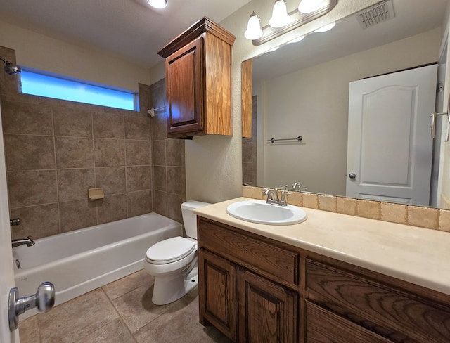 bathroom featuring visible vents, vanity, toilet, tile patterned floors, and  shower combination
