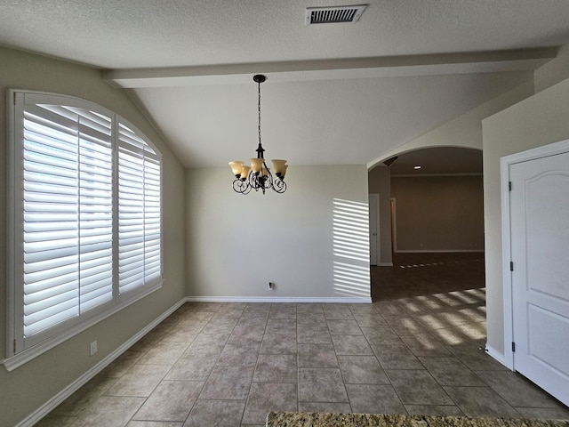 unfurnished dining area with a notable chandelier, lofted ceiling with beams, arched walkways, baseboards, and visible vents