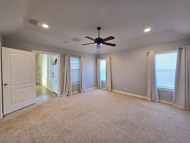 carpeted spare room with a ceiling fan, baseboards, visible vents, and recessed lighting