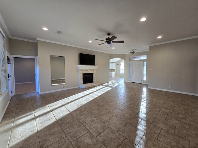 unfurnished living room featuring ceiling fan, arched walkways, recessed lighting, baseboards, and visible vents