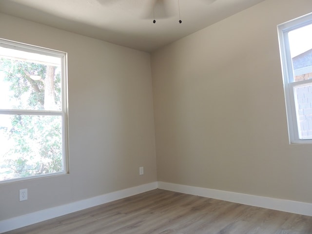 unfurnished room with light hardwood / wood-style floors and ceiling fan