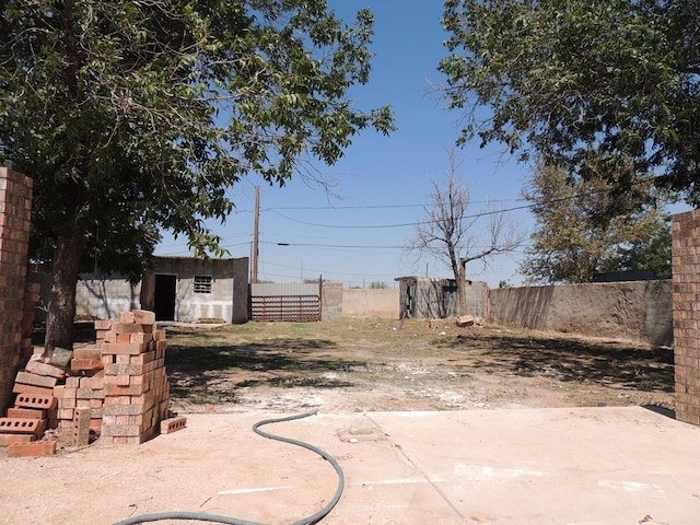 view of patio featuring a storage unit