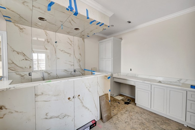 bathroom with ornamental molding and a shower