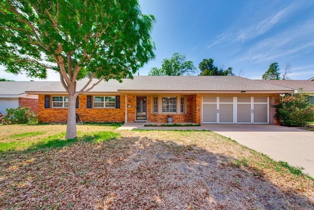 3211 W Shandon Ave, Midland, TX 79705 - single story home featuring an attached garage, brick siding, and driveway