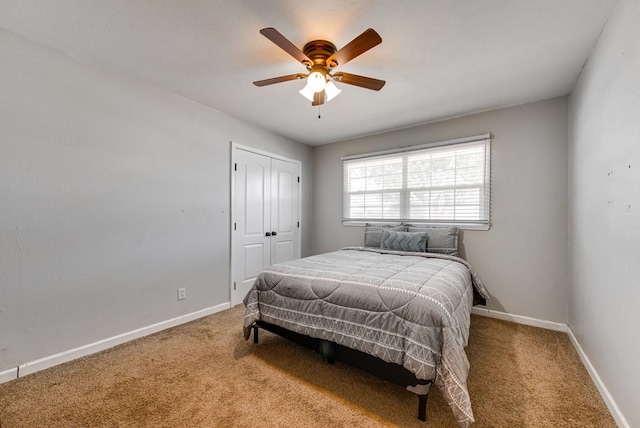 3211 W Shandon Ave, Midland, TX 79705 - carpeted bedroom featuring a closet, baseboards, and ceiling fan