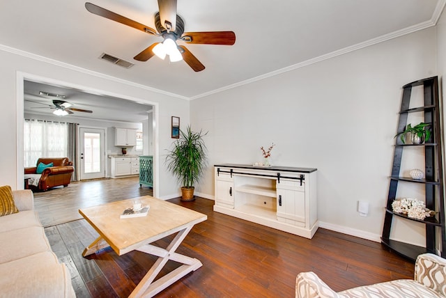 3211 W Shandon Ave, Midland, TX 79705 - living room featuring a ceiling fan, ornamental molding, hardwood / wood-style flooring, and baseboards