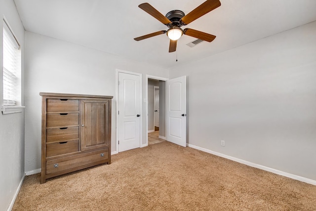 3211 W Shandon Ave, Midland, TX 79705 - unfurnished bedroom featuring light colored carpet, baseboards, and ceiling fan