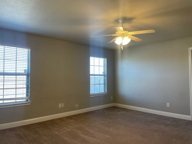 empty room with baseboards and a wealth of natural light