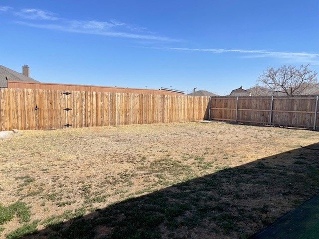 view of yard featuring a fenced backyard