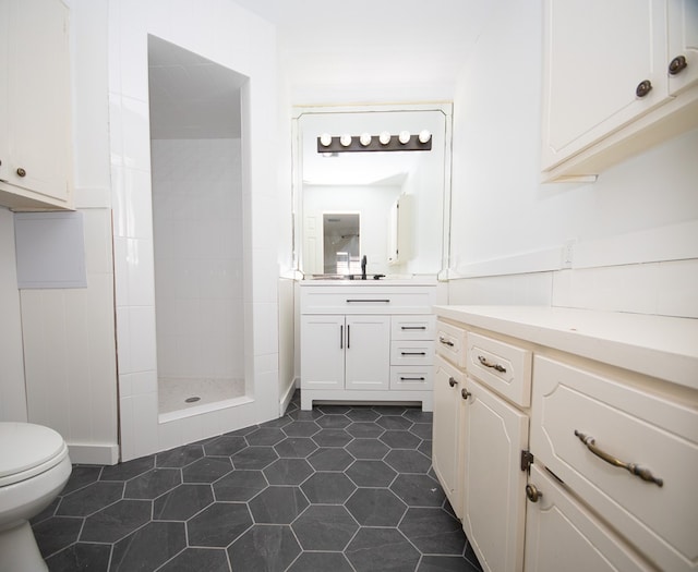2718 Central Ave, Big Spring, TX 79720 - bathroom featuring vanity, a tile shower, and tile patterned floors