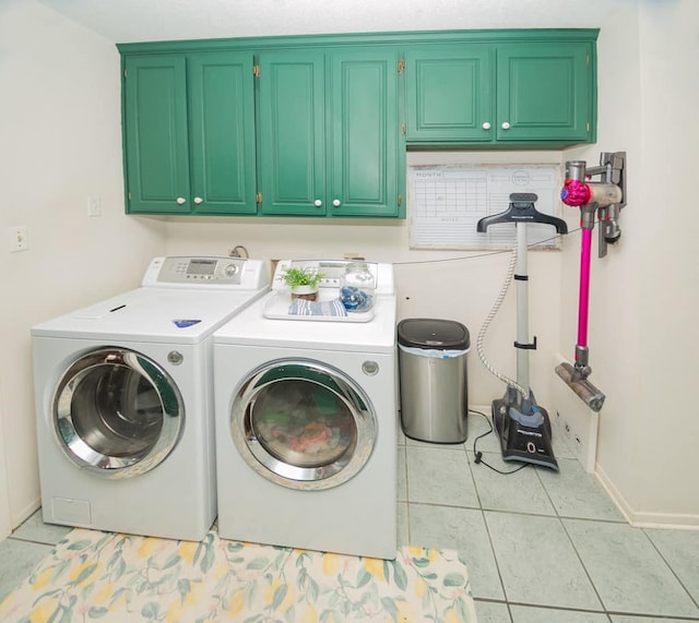2718 Central Ave, Big Spring, TX 79720 - washroom with cabinet space, separate washer and dryer, and light tile patterned floors