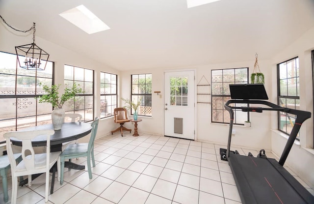 2718 Central Ave, Big Spring, TX 79720 - sunroom with lofted ceiling, a skylight, and a chandelier