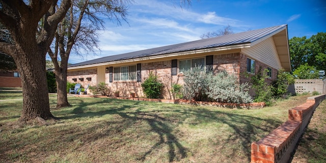 2718 Central Ave, Big Spring, TX 79720 - view of front of home featuring a front yard and a metal roof