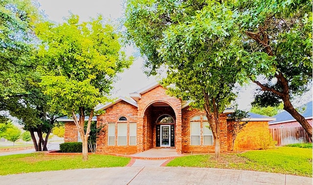 view of front of home with a front yard