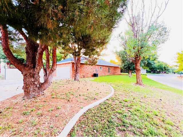 view of yard with a garage