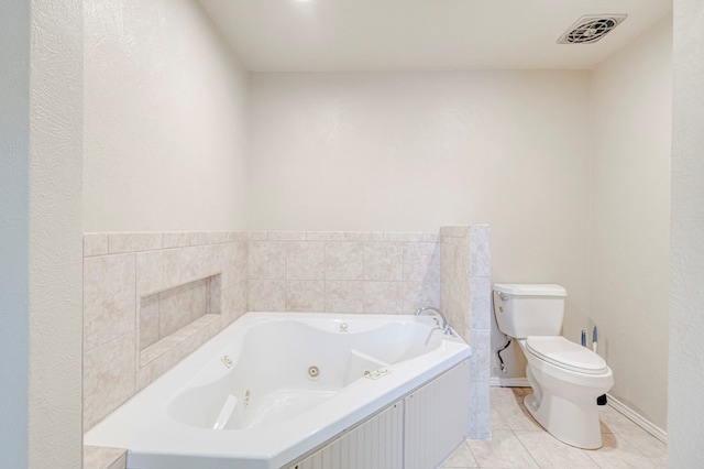2601 Dengar Ave W, Midland, TX 79705 - full bath with toilet, a whirlpool tub, tile patterned floors, and baseboards