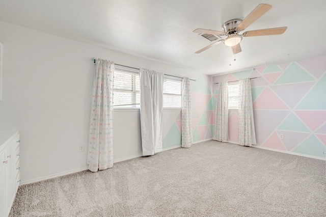2601 Dengar Ave W, Midland, TX 79705 - carpeted spare room with a ceiling fan and baseboards