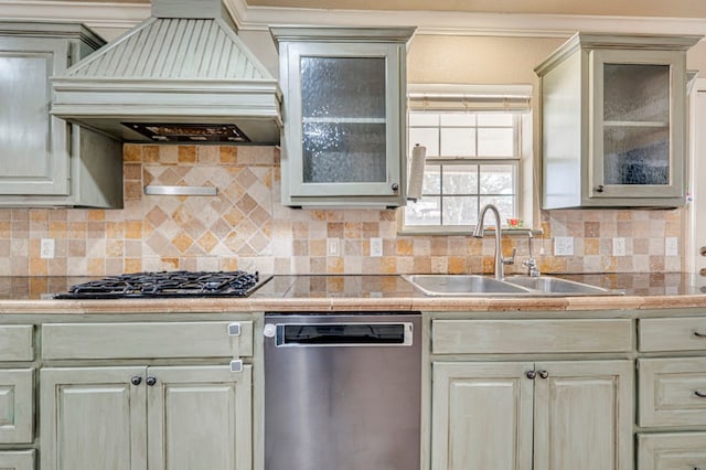 2601 Dengar Ave W, Midland, TX 79705 - kitchen featuring dishwasher, premium range hood, a sink, gas cooktop, and decorative backsplash