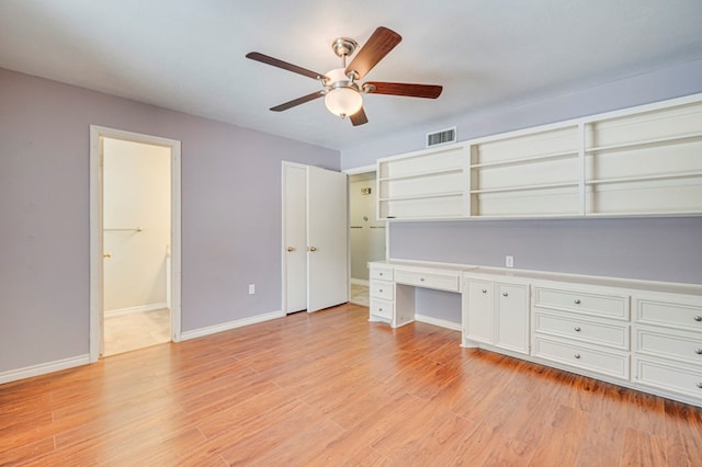 2601 Dengar Ave W, Midland, TX 79705 - unfurnished office featuring a ceiling fan, light wood-style flooring, and baseboards