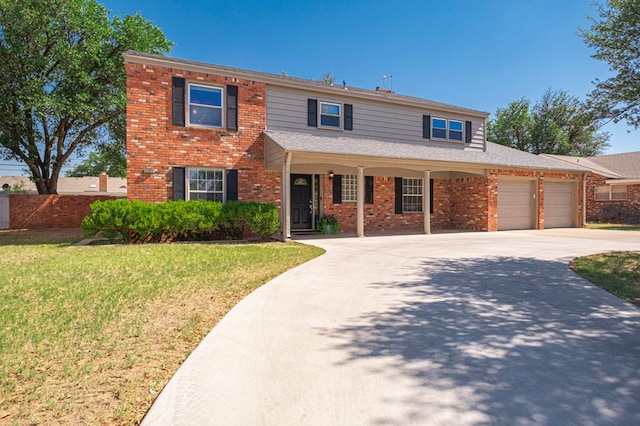 2601 Dengar Ave W, Midland, TX 79705 - traditional home featuring a garage, brick siding, concrete driveway, and covered porch
