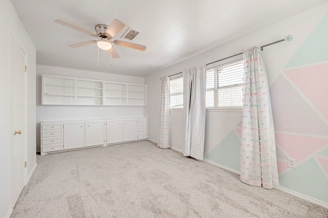 2601 Dengar Ave W, Midland, TX 79705 - unfurnished bedroom with light carpet, a ceiling fan, and baseboards