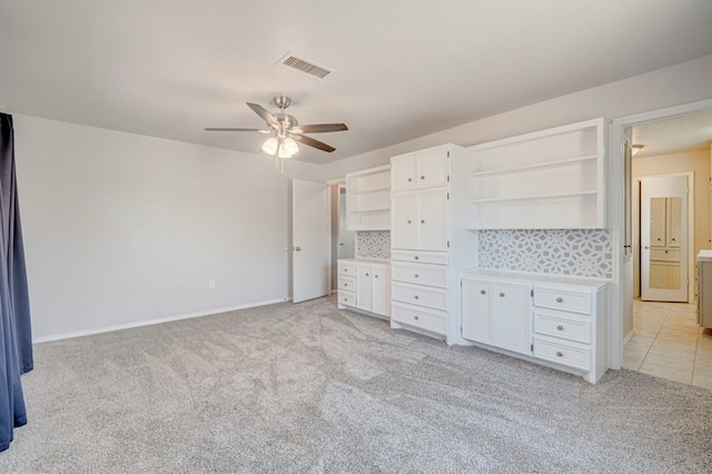 2601 Dengar Ave W, Midland, TX 79705 - unfurnished bedroom with light carpet, baseboards, and ceiling fan