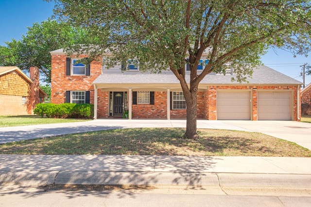 2601 Dengar Ave W, Midland, TX 79705 - traditional home featuring brick siding, concrete driveway, a garage, and a front lawn