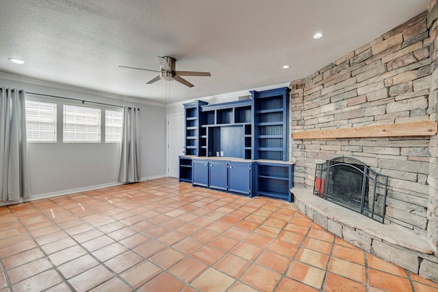 2601 Dengar Ave W, Midland, TX 79705 - unfurnished living room with a ceiling fan, crown molding, a fireplace, a textured ceiling, and recessed lighting
