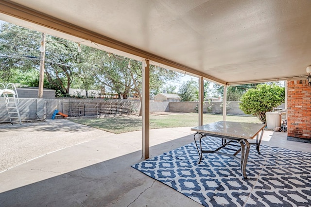 2601 Dengar Ave W, Midland, TX 79705 - fenced backyard with a patio area and outdoor dining space