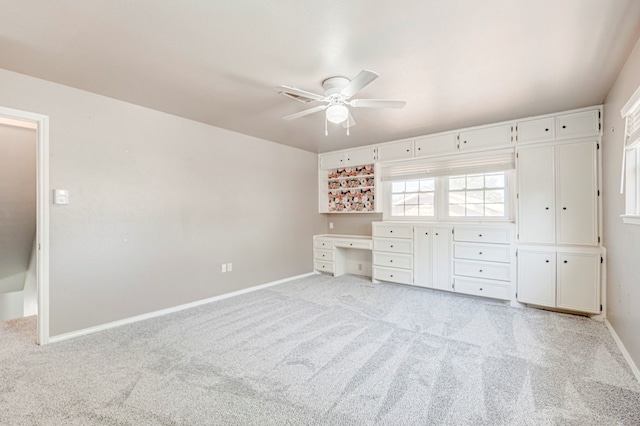 2601 Dengar Ave W, Midland, TX 79705 - unfurnished bedroom with light colored carpet, baseboards, and ceiling fan