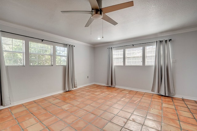 2601 Dengar Ave W, Midland, TX 79705 - unfurnished room featuring ceiling fan, crown molding, plenty of natural light, light tile patterned floors, and baseboards