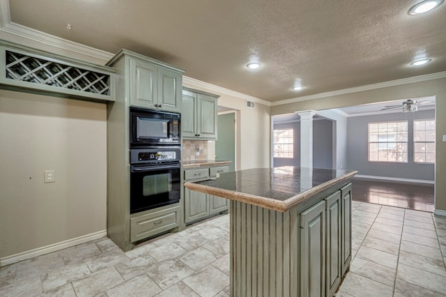 2601 Dengar Ave W, Midland, TX 79705 - kitchen with black appliances, ornate columns, baseboards, a textured ceiling, and recessed lighting