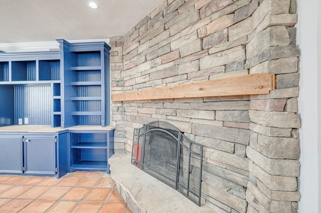 2601 Dengar Ave W, Midland, TX 79705 - unfurnished living room featuring a textured ceiling and a fireplace