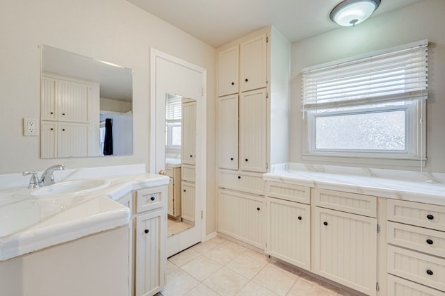 2601 Dengar Ave W, Midland, TX 79705 - bathroom with vanity, tile patterned floors, and healthy amount of natural light