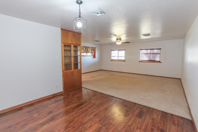 unfurnished room with hardwood / wood-style floors and ceiling fan