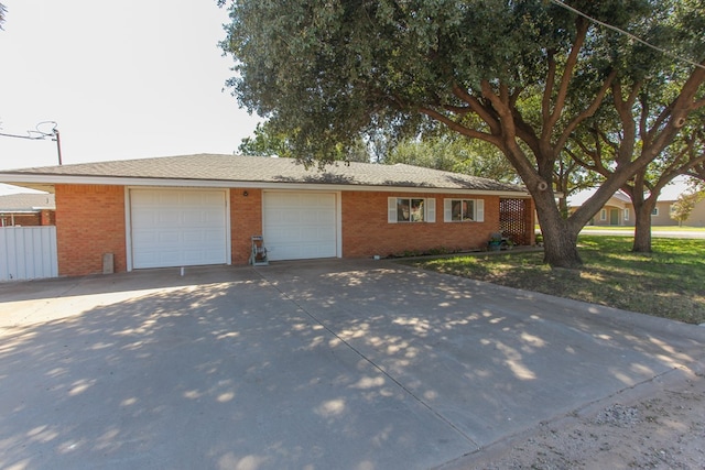 ranch-style house featuring a garage