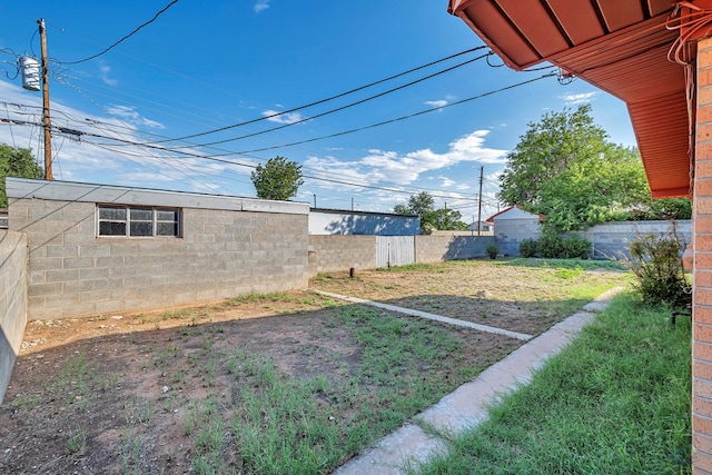 view of yard with a fenced backyard