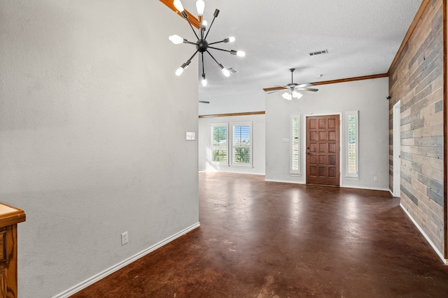 foyer entrance featuring ceiling fan with notable chandelier, a textured ceiling, and ornamental molding