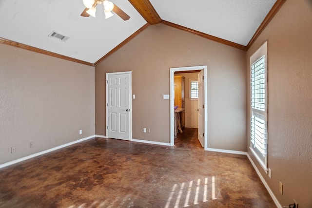 unfurnished bedroom with vaulted ceiling with beams, ceiling fan, dark carpet, and crown molding