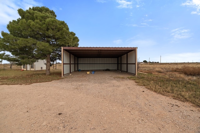 view of outdoor structure featuring a rural view